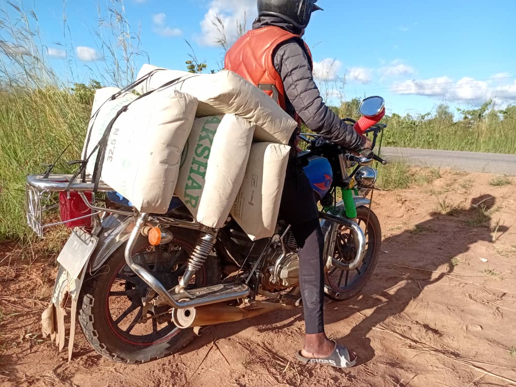 Cement arriving on motorbike